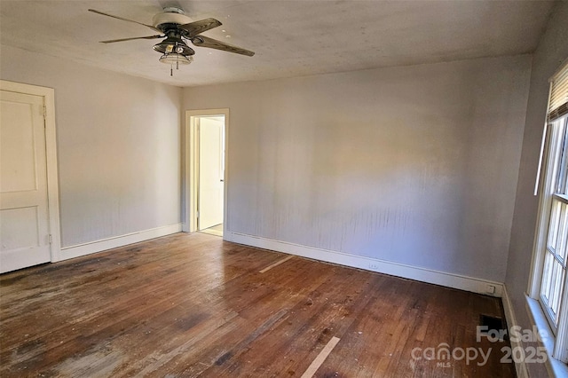 spare room featuring hardwood / wood-style flooring and ceiling fan