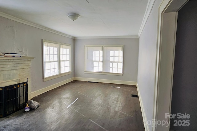 unfurnished living room with dark wood-type flooring, crown molding, and a fireplace