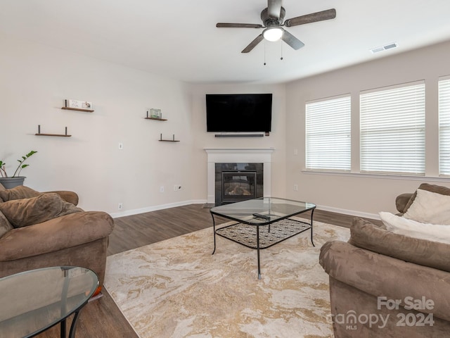 living room with hardwood / wood-style floors and ceiling fan