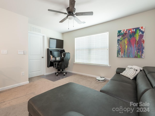 interior space with ceiling fan