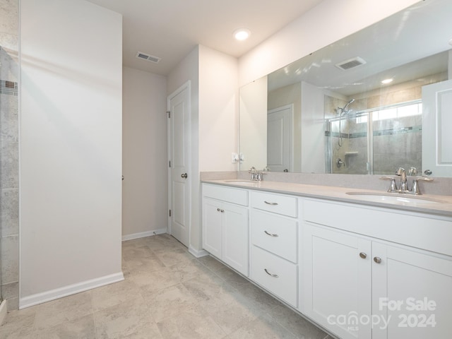 bathroom with vanity and walk in shower