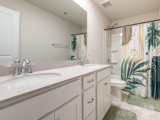 full bathroom featuring toilet, tile patterned flooring, vanity, and shower / tub combo with curtain