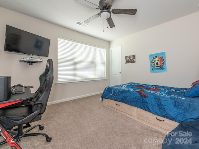 carpeted bedroom with ceiling fan