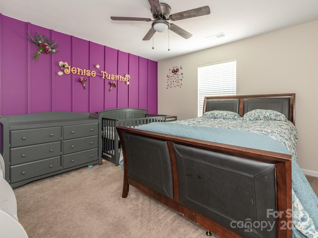 carpeted bedroom featuring ceiling fan