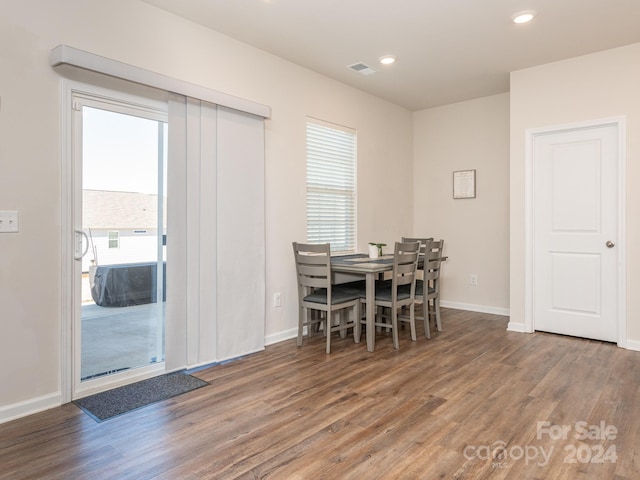 dining space featuring dark hardwood / wood-style flooring and a wealth of natural light