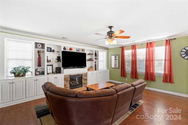 living room featuring ceiling fan, dark hardwood / wood-style flooring, and crown molding