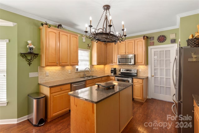 kitchen featuring decorative light fixtures, a center island, stainless steel appliances, and dark hardwood / wood-style floors