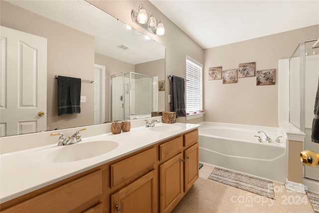 bathroom featuring tile patterned flooring, vanity, and plus walk in shower