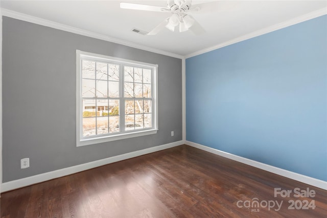 empty room featuring crown molding, ceiling fan, and dark wood-type flooring