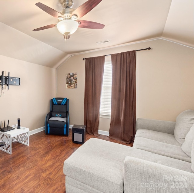 interior space featuring dark hardwood / wood-style floors, ceiling fan, and lofted ceiling