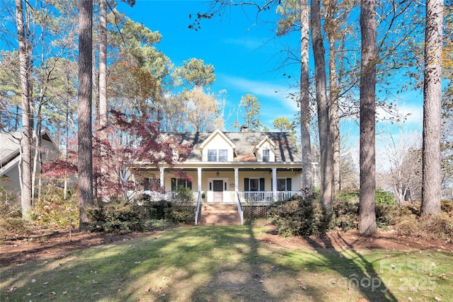 view of front of property with a front yard and a porch