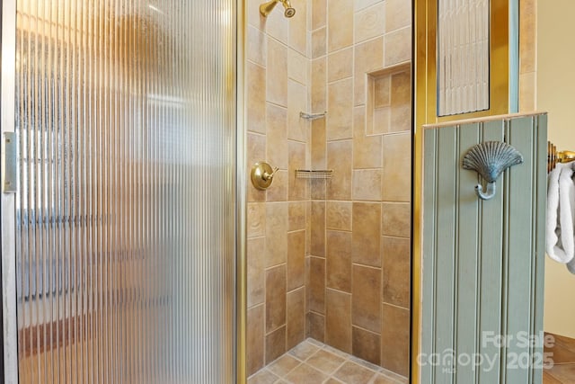 bathroom with tiled shower