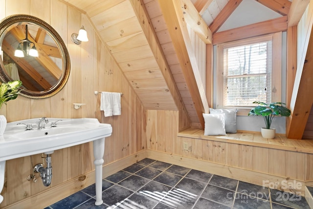 bathroom featuring wood ceiling, lofted ceiling, and wooden walls