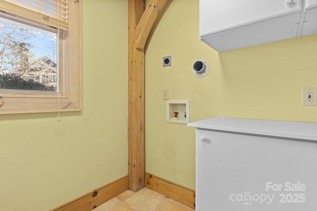 laundry room with hookup for a washing machine, electric dryer hookup, and light tile patterned floors