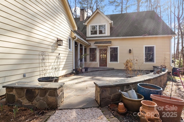 rear view of house featuring a patio