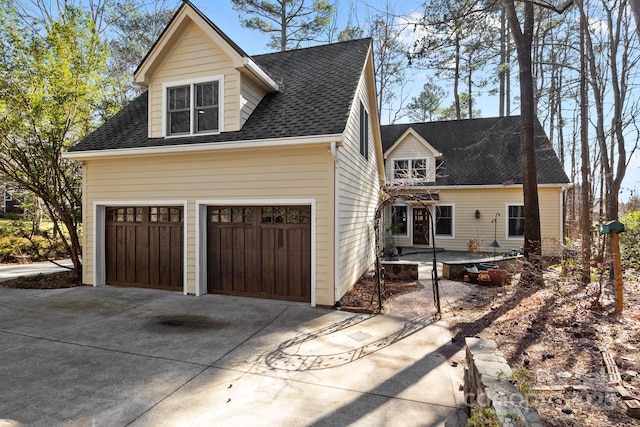 new england style home with a garage