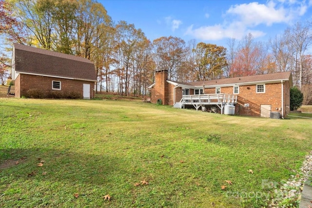 view of yard with cooling unit and a wooden deck