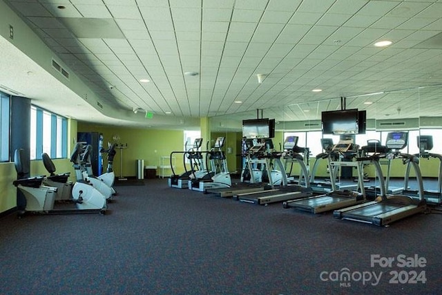 exercise room with a drop ceiling