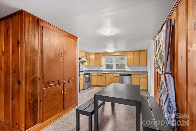 kitchen featuring light tile patterned flooring, sink, and appliances with stainless steel finishes