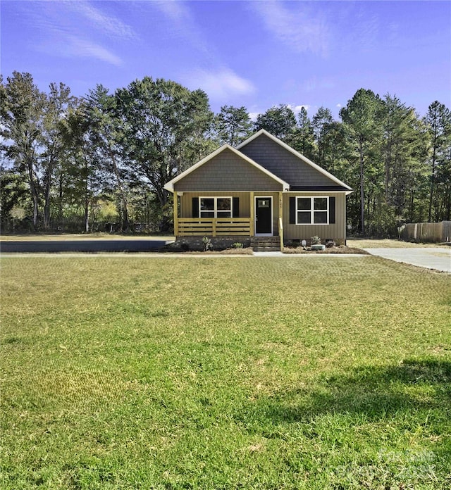 view of front facade featuring board and batten siding and a front lawn