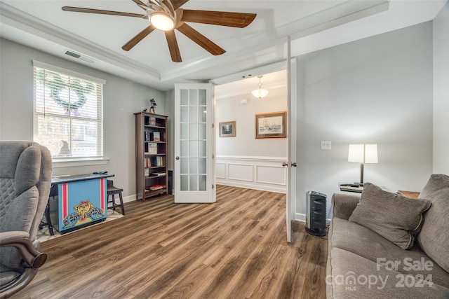 office with french doors, a raised ceiling, ceiling fan, and wood-type flooring