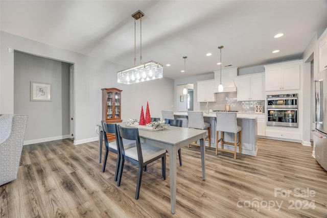 dining room with light hardwood / wood-style flooring