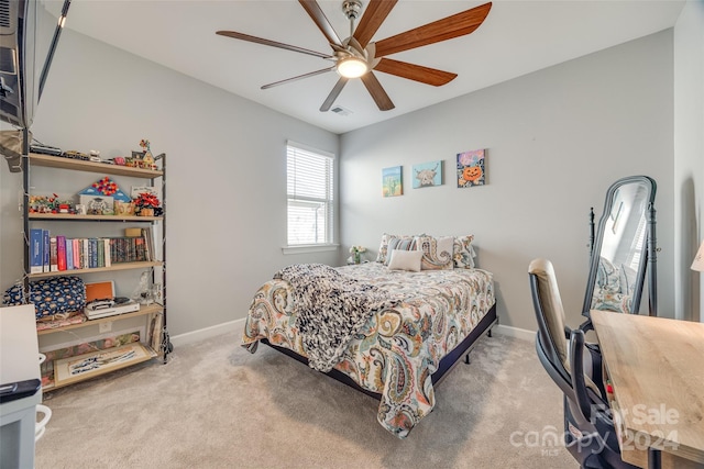 bedroom with ceiling fan and light colored carpet