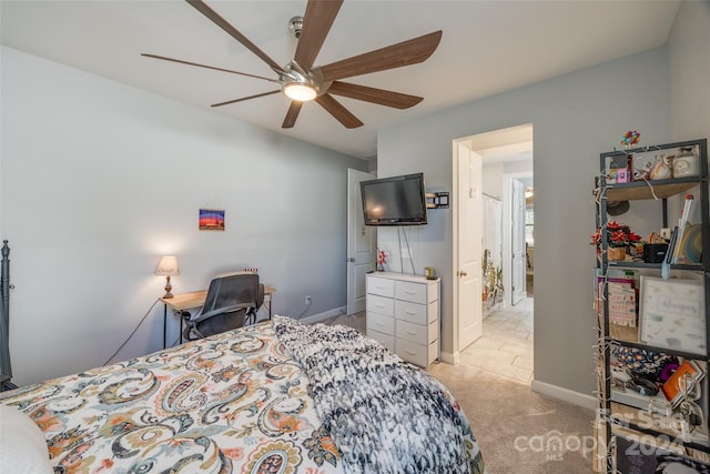 bedroom with light carpet and ceiling fan