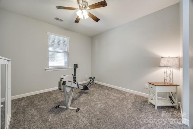 workout area featuring ceiling fan and carpet floors