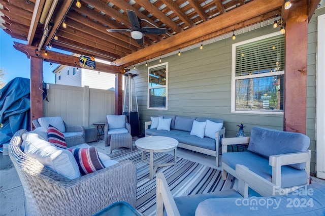 view of patio with outdoor lounge area and ceiling fan