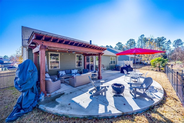 back of house featuring a jacuzzi, a patio, and an outdoor living space