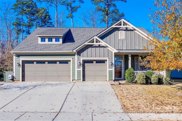 view of front of home with covered porch and a garage