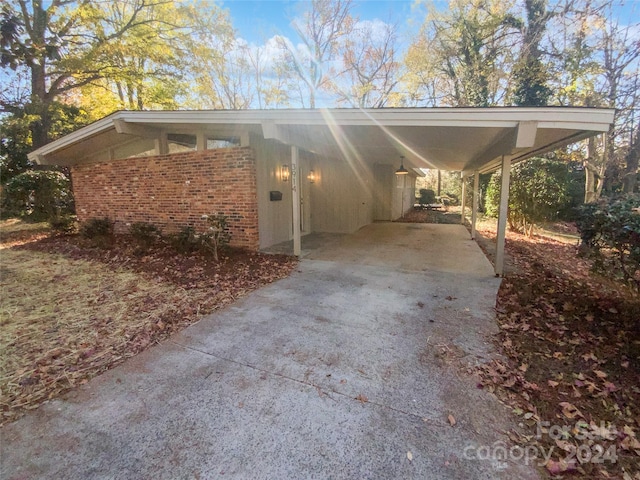 view of side of home featuring a carport