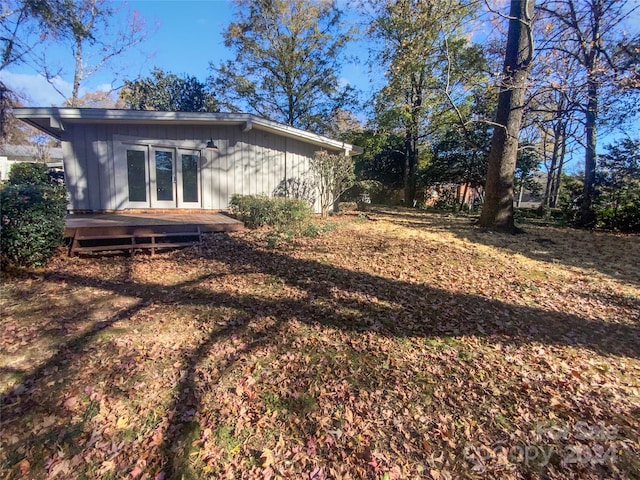 back of property featuring french doors and a deck