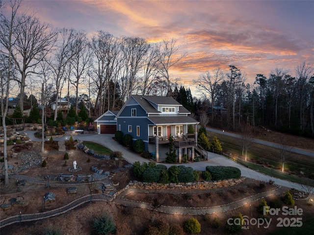 view of front of property featuring a porch and stairway