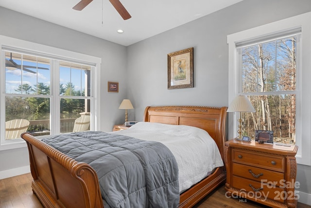 bedroom featuring ceiling fan, recessed lighting, wood finished floors, and baseboards