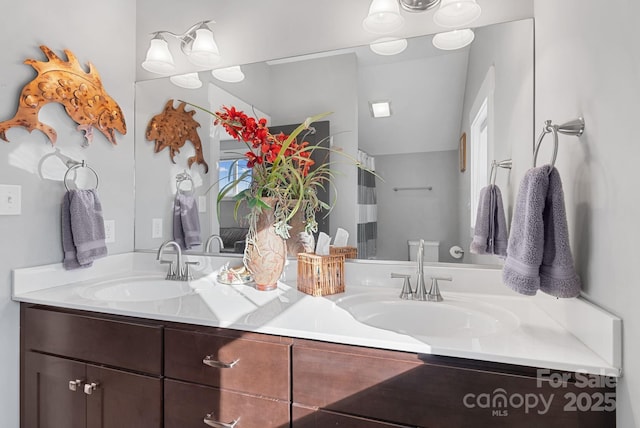 bathroom featuring double vanity and a sink