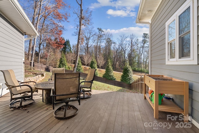 deck with fence and outdoor dining space