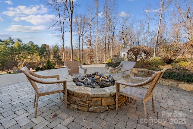 view of patio / terrace with an outdoor fire pit