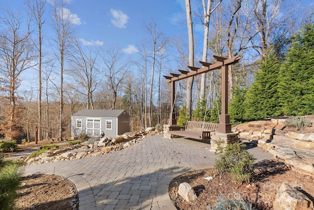 view of patio featuring an outbuilding, a wooden deck, and a storage shed