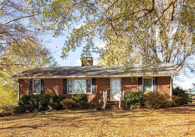 ranch-style house with a front yard