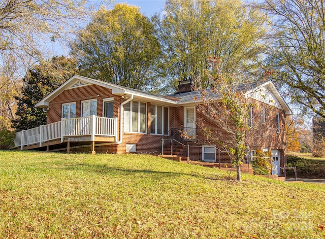 single story home featuring a garage and a front lawn