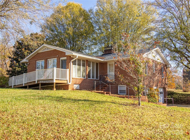654 Meadowlark Dr, Winston Salem, NC 27106 - ranch-style home with brick siding, a chimney, a front lawn, and a wooden deck