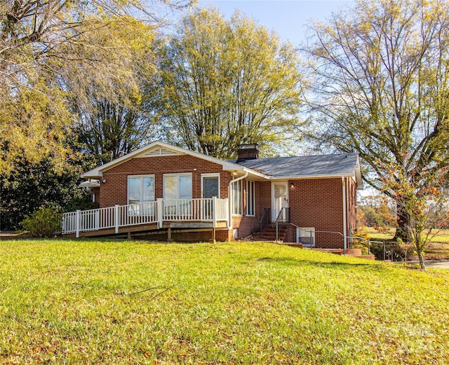654 Meadowlark Dr, Winston Salem, NC 27106 - view of front of house with brick siding, a chimney, and a front yard
