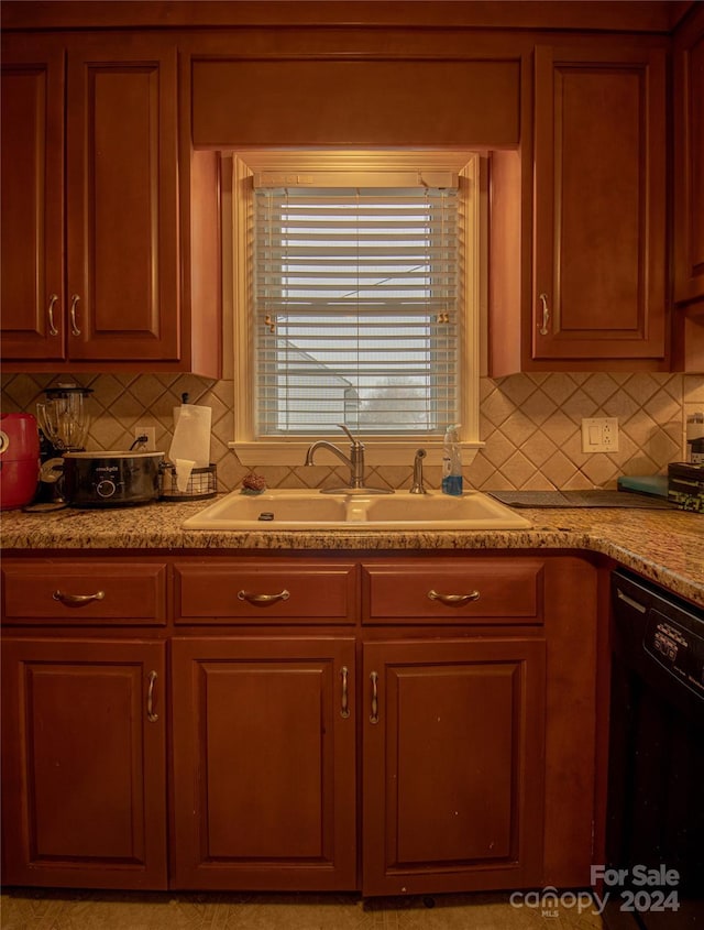 654 Meadowlark Dr, Winston Salem, NC 27106 - kitchen with black dishwasher, backsplash, and light countertops