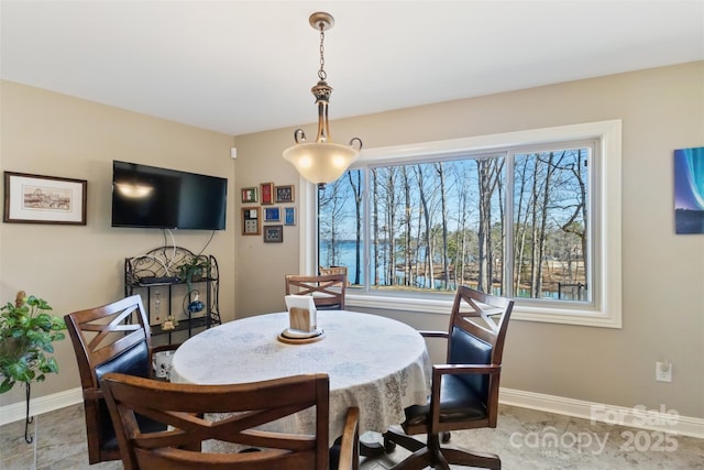 dining space featuring baseboards