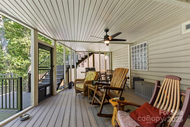 wooden terrace featuring stairway and a ceiling fan