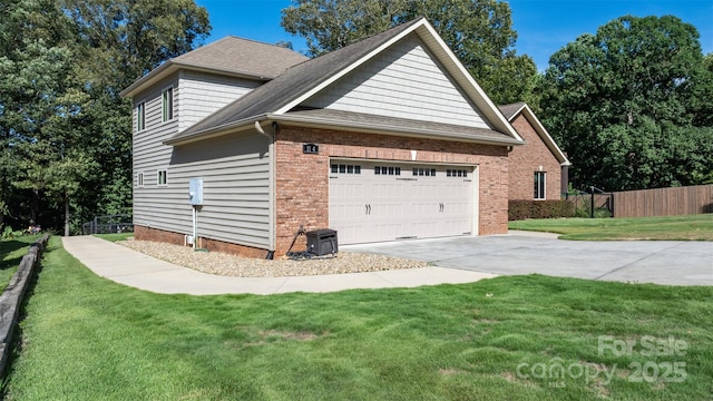 view of side of home featuring fence, an attached garage, concrete driveway, a lawn, and brick siding