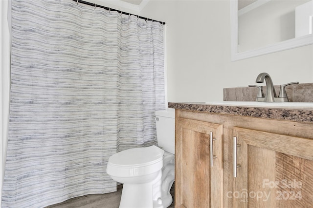 bathroom featuring vanity, toilet, and tile walls