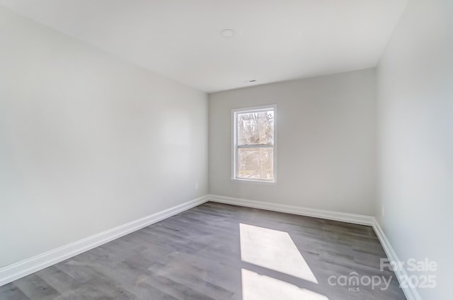 spare room featuring hardwood / wood-style floors